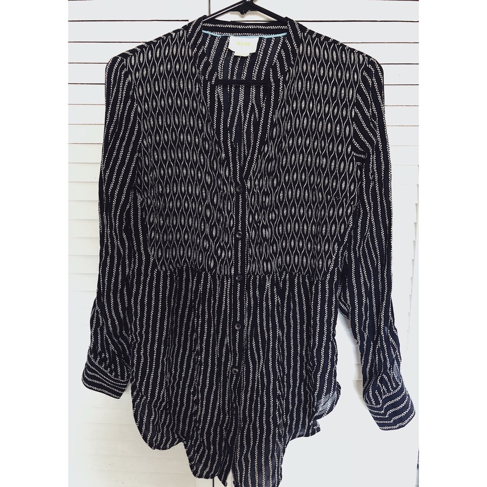 Long sleeved black and cream blouse
